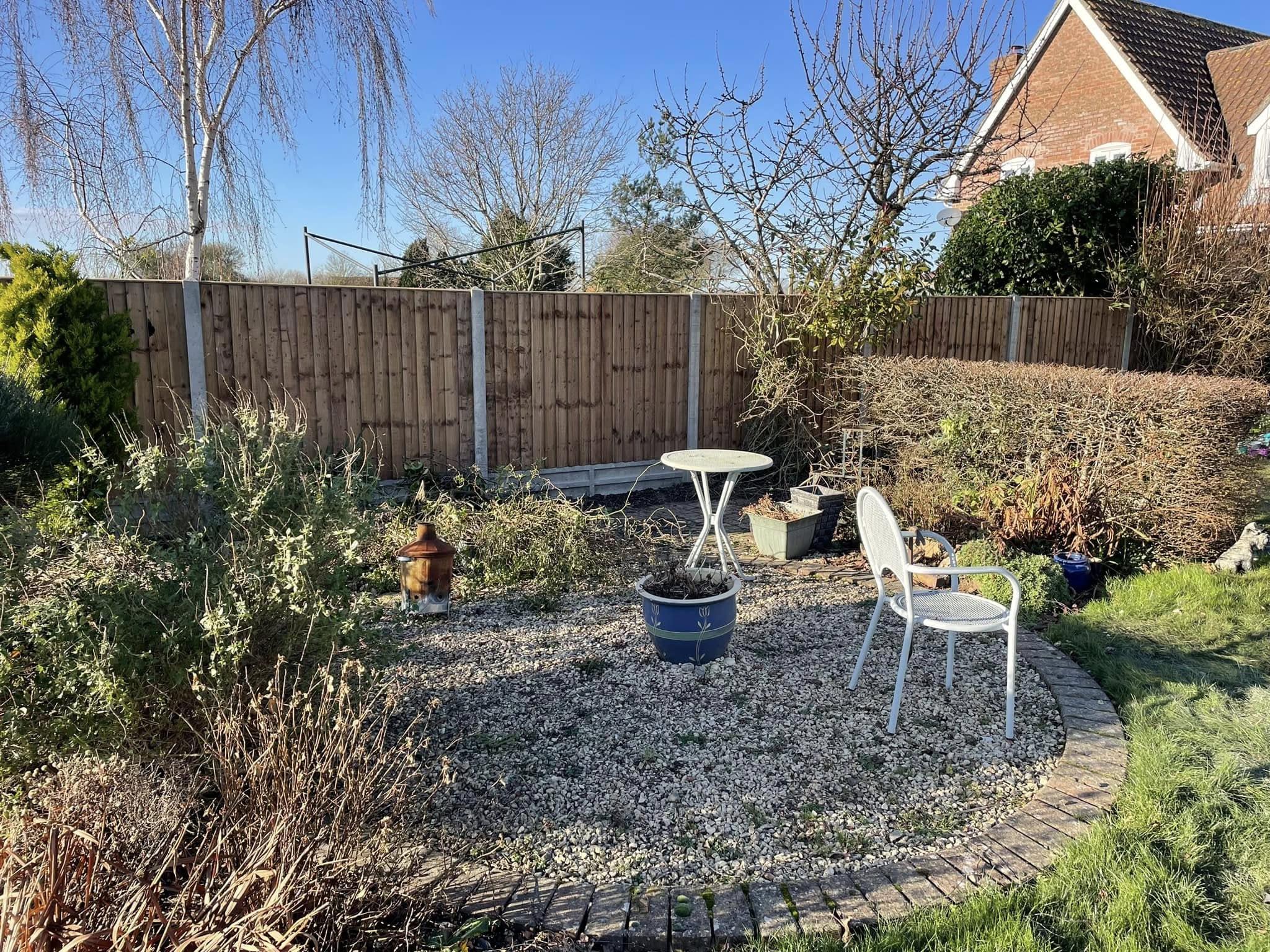 Well-maintained garden featuring premium fencing and landscaping