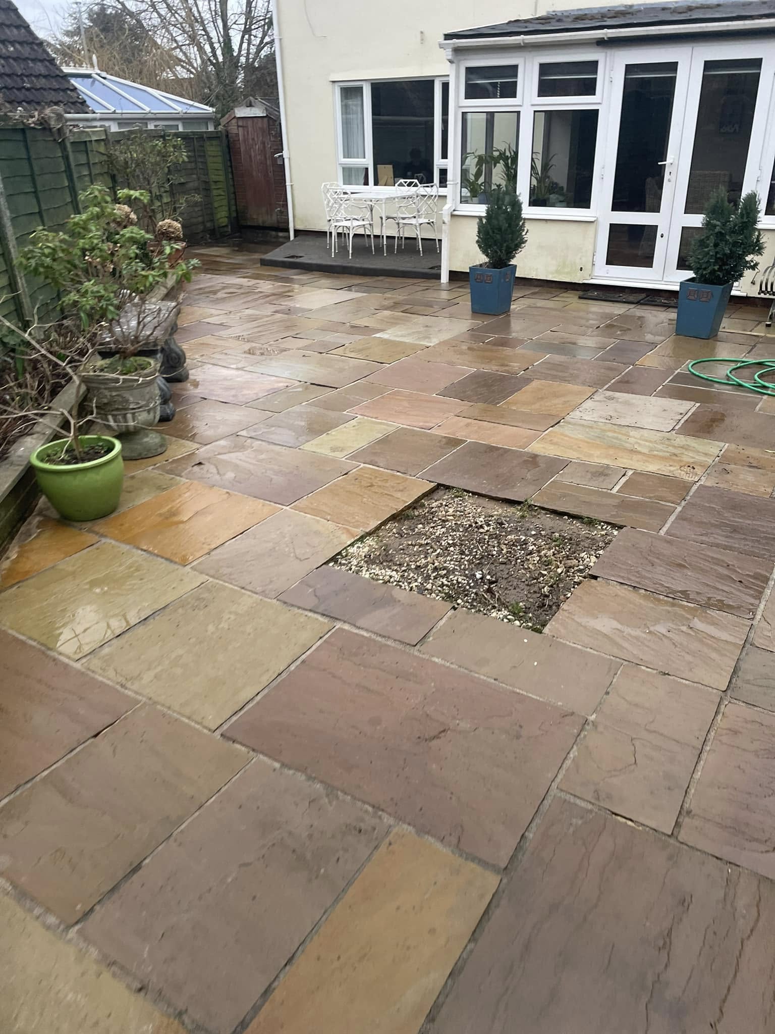 Stone pathway connecting patio and garden seating area