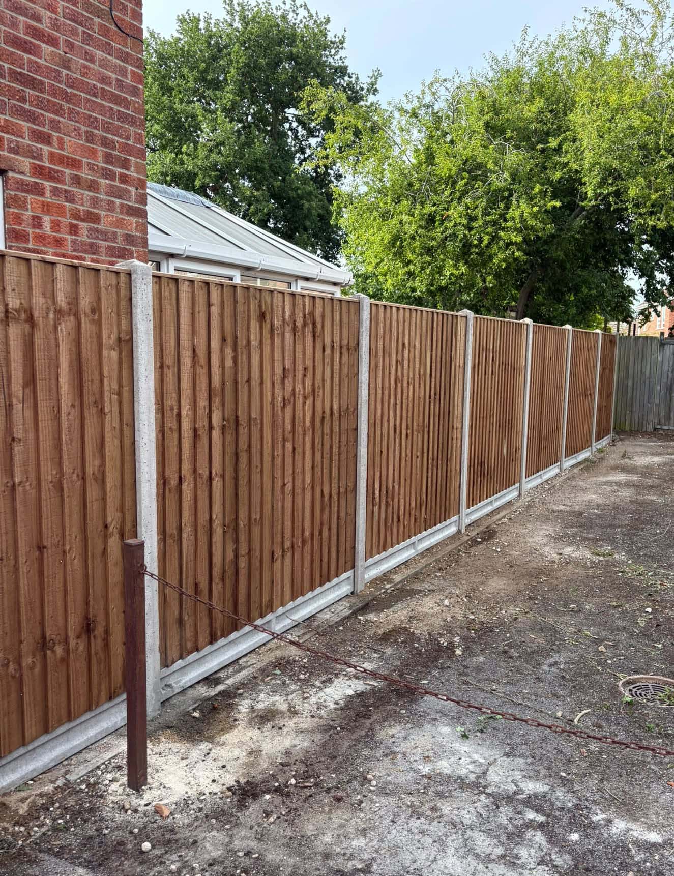 Freshly installed wooden garden fence